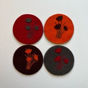 ‏Handcrafted felt coasters and embroidered with silk threads.at of 4